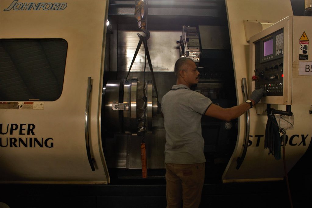Operator running a CNC turning centre